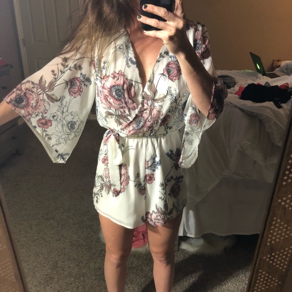 Charlotte Russe Pants - Floral romper with bell sleeves size small